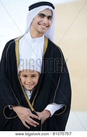 Happy Arabic boy wearing shaikh clothes
