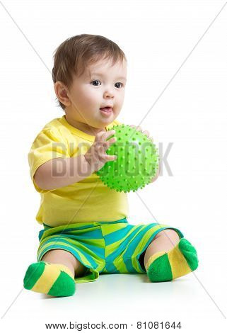 baby boy playing with massage ball