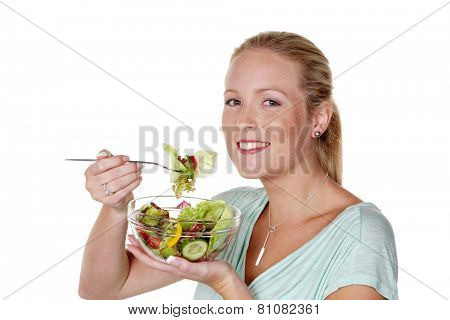 a young woman eating a crunchy salad at lunch time. healthy diet with vitamins