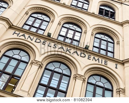 writing a business college on a school building