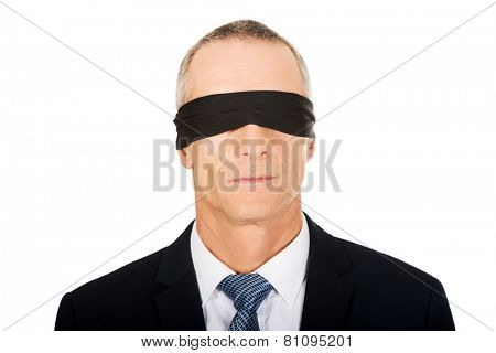 Mature businessman with band on eyes.