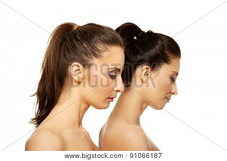 Two attractive sisters with make up.