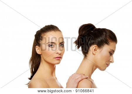 Beauty woman with make up standing behind her friend.