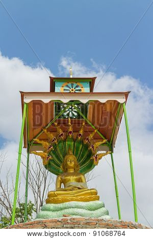 Buddha satue sitting with king of naga