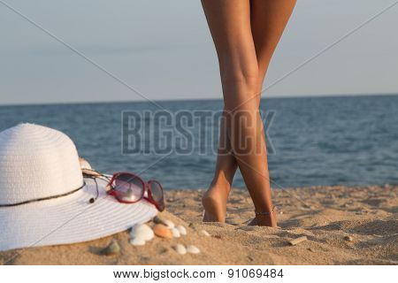 Legs Of A Girl On A Beach