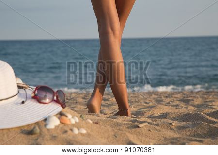 Legs Of A Girl On A Beach