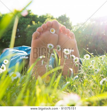 Children's feet in the grass