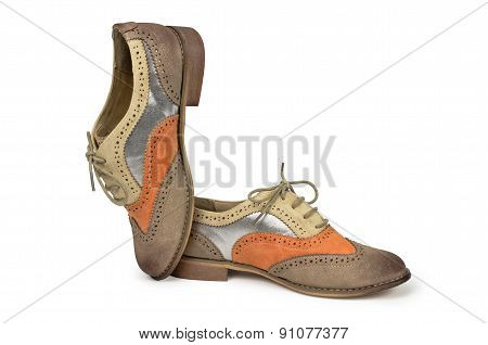 Beautiful brown and orange woman shoes isolated on white backgro