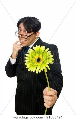 Young man in black costume with flower isolated on white