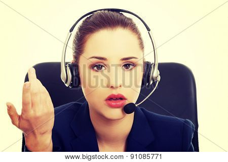 Portrait of anoyed support phone operator in headset