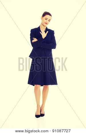 Anoyed and displeased businesswoman standing
