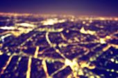 Big city night lights bokeh, blurred background. Vintage style, nightlife blur