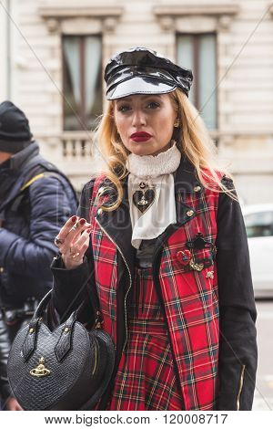 MILAN ITALY - FEBRUARY 25: Fashionable woman poses outside Luisa Beccaria fashion show building for Milan Women's Fashion Week on FEBRUARY 25, 2016 in Milan.
