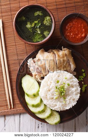 Hainanese Chicken Rice, Chilli Sauce And Bouillon Close-up. Vertical Top View
