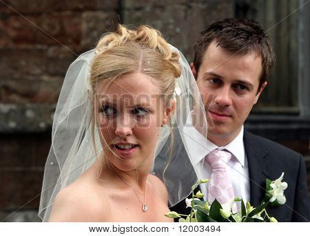 Beautiful blonde bride glancing sideways