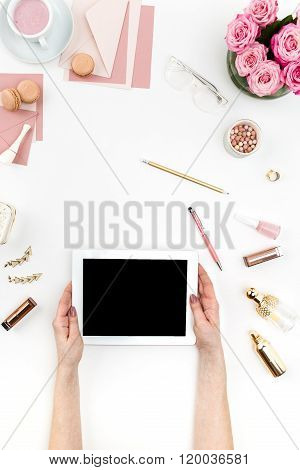 The female hands and tablet