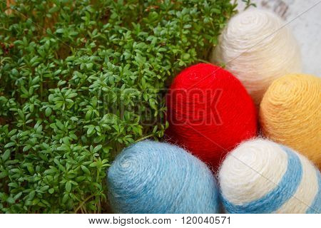 Easter Eggs Wrapped Woolen String And Green Cress On Wooden Background, Decoration For Easter