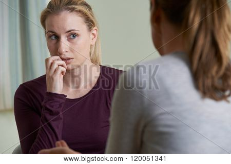 Young Woman Discussing Problems With Counselor