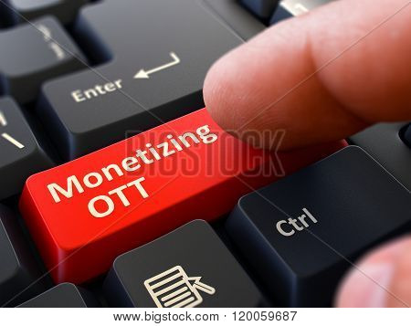 Finger Presses Red Keyboard Button Monetizing OTT.