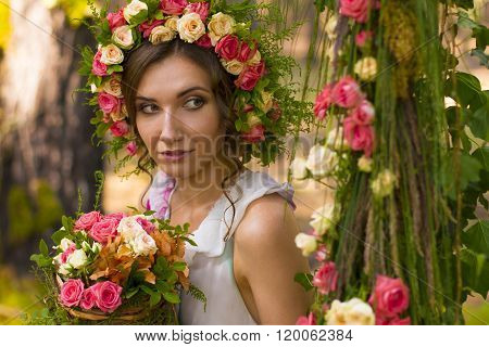 Beautiful lady in wreath of flowers.