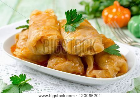 Stuffed Cabbage Rolls With Rice And Meat On A White Plate