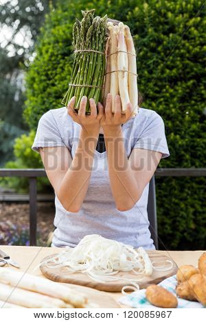 Woman Is Holding Sundry Asparagus