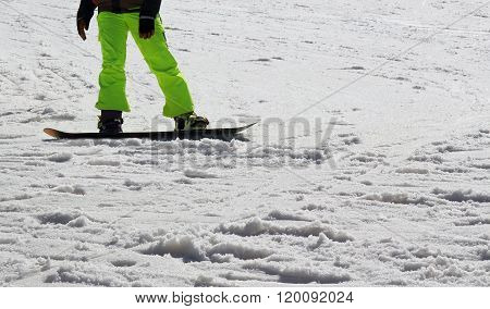Snow Boarder - close up of Snow Boarder legs on the slope
