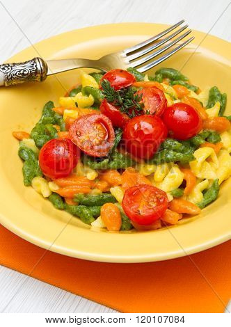 Colored Spatzle On Yellow Dish