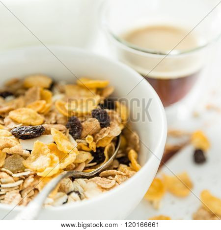 Breakfast - muesli and fruits on white background