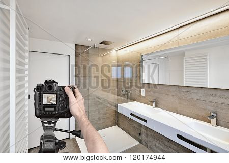 Hands Holding A Professional Camera On Tripod Taking Picture
