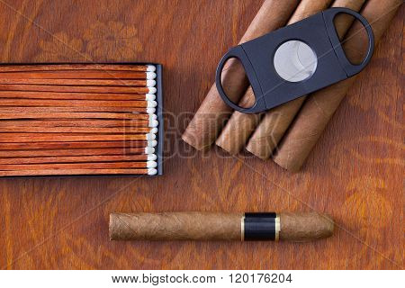 Different Cigars On The Decorative Wooden Desk