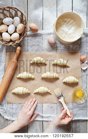 Unrecognizable man hands prepare dough for croissant sweet dessert