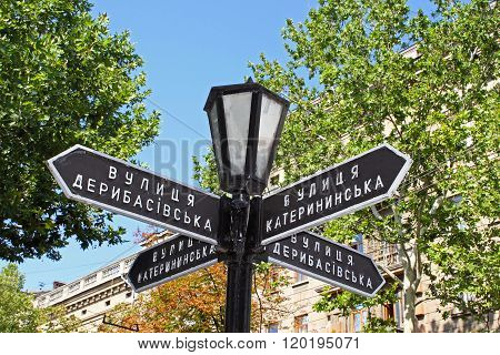 Old Lantern With Street Signs To Famous Deribasovskaya Street In Downtown Odessa, Ukraine