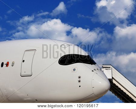 MOSCOW REGION  -   AUGUST 27 2015: 
Wing fuselage and turbine of the largest passenger aircraft Il 76Front of large passenger jet with attached ladder  -  on August 27, 2015 in Moscow region