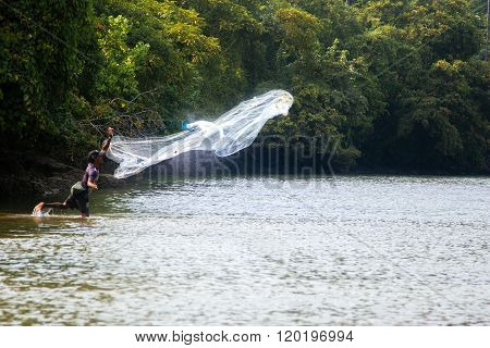 AGONDA, INDIA - OCTOBER 13, 2015: Unidnetified sea shore fisherman at Agonda beach India. Agonda is a traditional fishing village.