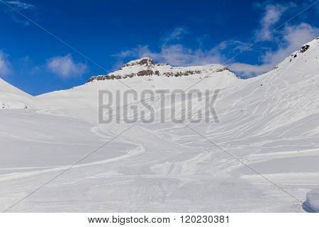Snowy Mountains With Ski Tracers