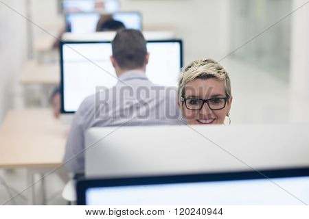 startup business, woman  working on dektop  computer at creative modern office relaxing and have fun