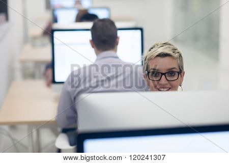 startup business, woman  working on dektop  computer at creative modern office relaxing and have fun