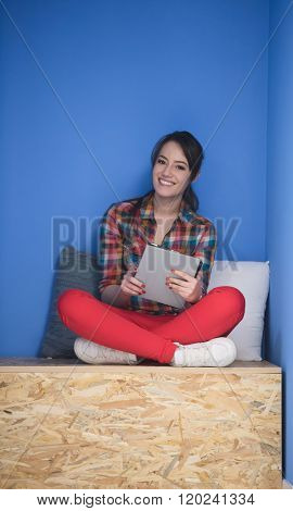 young woman in crative box working on tablet computer, startup business modern office room  interior