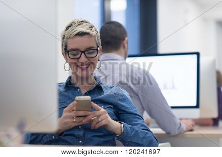 startup business, woman  working on dektop  computer at creative modern office relaxing and have fun
