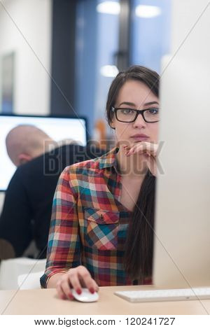 startup business, woman  working on dektop  computer at creative modern office relaxing and have fun