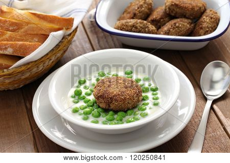 green peas fozelek (thich vegetable stew) and fasirt (fried meatball), hungarian cuisine