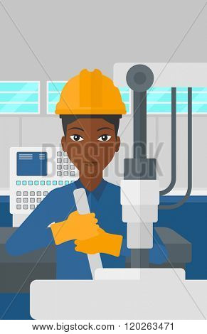 Woman working with industrial equipment.