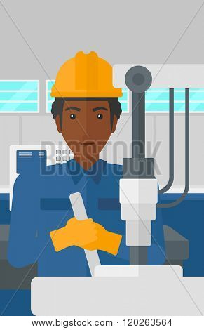 Man working with industrial equipment.