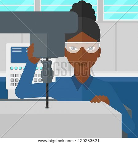 Woman working with boring mill.