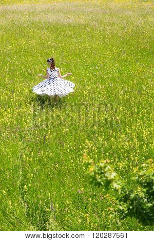 Pin Up Girl Is Twisting In A Wildflower Meadow