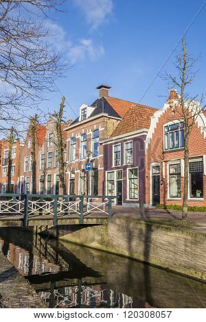 Colorful Houses And A Bridge At A Canal In Franeker