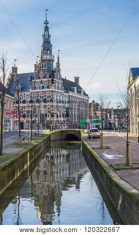 Historical Town Hall Along A Canal In Franeker