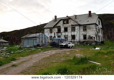 Abandoned homes and cars of the village Teriberka Murmansk region