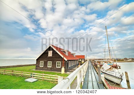 Yacht On Harbor And Blue Sky In Hindeloopen